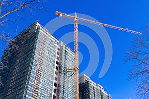 Construction crane on the construction of the house