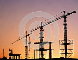 Construction crane at the construction site of a Tower crane and building under