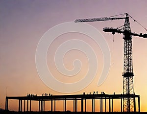 Construction crane at the construction site of a Tower crane and building under