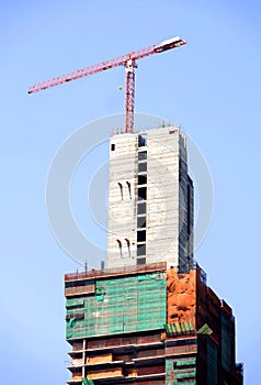 Construction crane on high buiding site