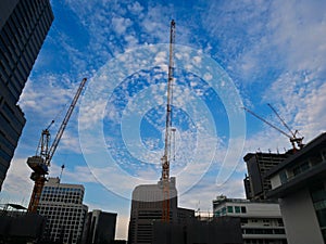 Construction Crane Industry site for high building and blue sky background with copy space