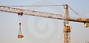 Construction crane lifting cargo