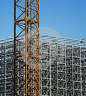 Construction crane with a metal structure frame