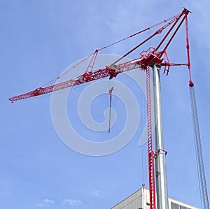 Construction crane metal structure lifting machine blue sky