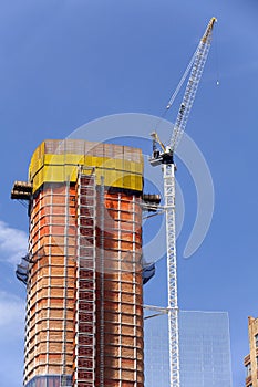 Construction - Crane and new highrise apartment building