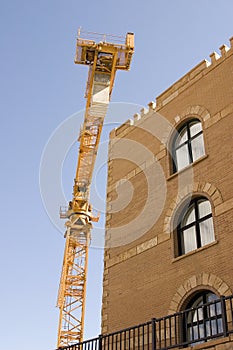 Construction Crane next to a Building