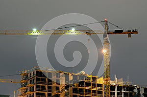 Construction crane at night.