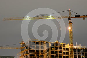 Construction crane at night.