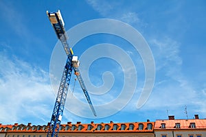 Construction crane over the attics photo