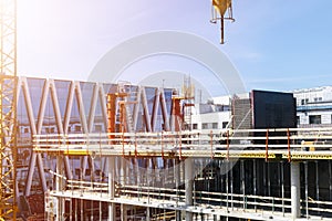 Construction crane tower on blue sky background. Crane and building working progress. Worker. Empty Space for text. Construction c