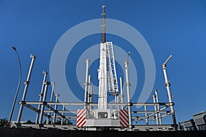 Construction crane towering over structural steel framing for new building