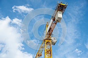 Construction crane working on large construction site