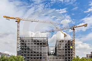 Construction cranes at big building construction site