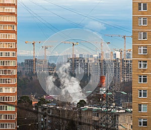 Construction cranes build new buildings. Troitsk Is A District Of New Moscow