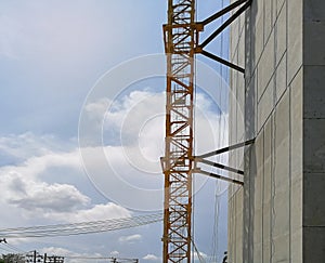 Construction cranes machine against sky background. Under construction