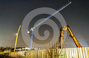 Construction cranes, Nitra, Slovakia, night scene