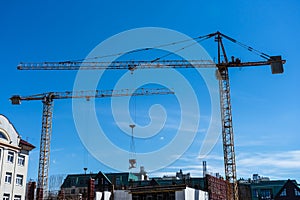 Construction cranes in the sky