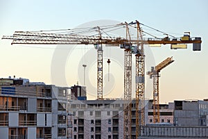 Construction cranes work in thef Helsinki in winter