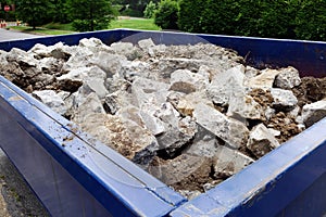 Construction Dumpster with Concrete Debris