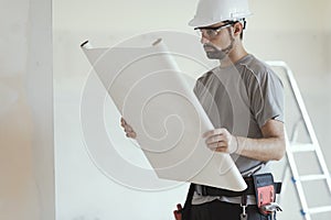 Construction engineer checking a house plan