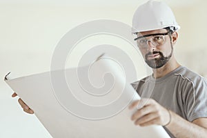 Construction engineer checking a house plan