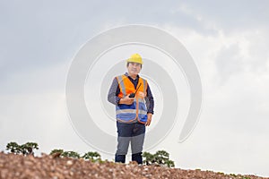 Construction engineer checking project at the building site, Foreman worker in hardhat at the infrastructure construction site