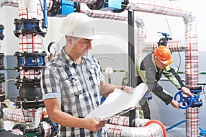 Construction engineer worker at industrial boiler room