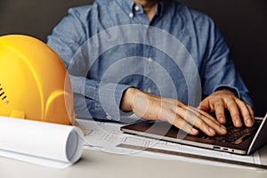 Construction engineer working with laptop at his office