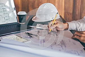 Construction engineering or architect hands working on blueprint inspection in workplace, while checking information drawing and