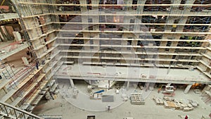 Construction equipment material with scaffolding and tools inside the floor of high rising building timelapse