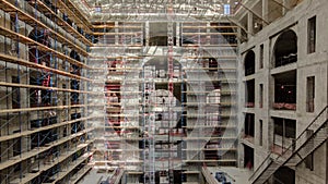 Construction equipment material with scaffolding and tools inside the floor of high rising building timelapse