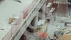 Construction equipment material with scaffolding and tools inside the floor of high rising building timelapse