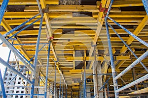 Construction site work. Concrete formwork and floor bams. Construction beam falsework for concrete