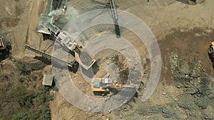 Construction equipment working at quarry.