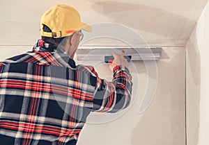 Construction Finishing Worker Patching Drywall