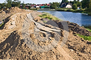 Construction of a floodbank or levee along a river