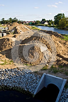 Construction of a floodbank or levee along a river