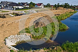 Construction of a floodbank or levee along a river