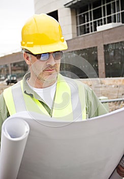 Construction Foreman looking at Blueprints