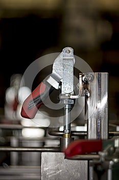 Construction form tool to fasten pieces for welding and processing metal iron or steel in an industrial factory closeup