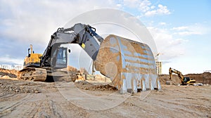 Construction of foundation excavator works in sand pit. Groundworks, site levelling, construction of reinforced ground beams