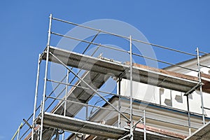 Construction frame next to a building under restoration
