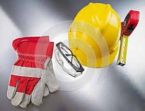 Construction Gear on Silver Tabletop with Hardhat