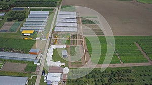 Construction of greenhouses in the field. Clip. Agriculture, agrotechnics of closed ground. Frameworks of greenhouses photo