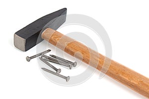 Construction hammer and nails on a white background