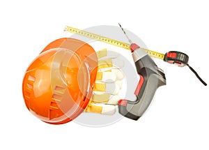 Construction hard hat, roulette, gloves, drill