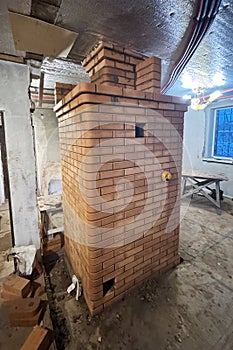 Construction of a heating stove. Rear side. Final work.