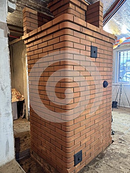 Construction of a heating stove. Rear side. Final work.