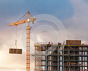 Construction of a high-rise building with a crane