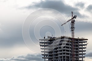 Construction of high-rise building with crane